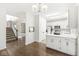 Open kitchen with white cabinets, modern appliances, and seamless flow into the dining area at 6818 Bluffridge Dr, Indianapolis, IN 46278