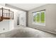 Bright living room with large windows offering ample natural light and a view of the outdoors at 6818 Bluffridge Dr, Indianapolis, IN 46278
