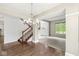 Open-concept living space featuring hardwood flooring, staircase, and ample natural light at 6818 Bluffridge Dr, Indianapolis, IN 46278