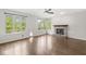 Spacious living room with a fireplace and large windows offering natural light at 6818 Bluffridge Dr, Indianapolis, IN 46278