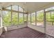 Inviting screened porch featuring wood flooring and an open view to the backyard at 6818 Bluffridge Dr, Indianapolis, IN 46278