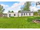 Spacious backyard features a well-maintained lawn, updated siding, and a cozy fire pit for outdoor enjoyment at 695 W Clinton St, Danville, IN 46122