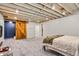 Finished basement bedroom with sliding barn door, and exposed unfinished ceiling at 695 W Clinton St, Danville, IN 46122