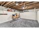 Unfinished basement storage area with painted walls and exposed ceiling at 695 W Clinton St, Danville, IN 46122
