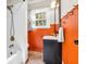 Bathroom with tiled shower, vanity, and window with natural light at 695 W Clinton St, Danville, IN 46122