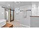 Modern bathroom with wood-framed sliding door, and a black towel bar at 695 W Clinton St, Danville, IN 46122