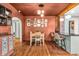 Stylish dining room with hardwood floors, gallery wall and modern pendant lights at 695 W Clinton St, Danville, IN 46122