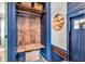 Entryway features a wood bench, storage, colorful design touches, and views to the front door at 695 W Clinton St, Danville, IN 46122