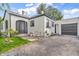 Charming home showcasing the front entrance, driveway, and garage at 695 W Clinton St, Danville, IN 46122