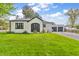 Charming home with a well-manicured lawn and attached two-car garage at 695 W Clinton St, Danville, IN 46122