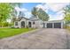 Lovely home with a lush green lawn and convenient driveway to the attached garage at 695 W Clinton St, Danville, IN 46122