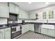 Bright kitchen with stainless steel appliances, tile flooring and plenty of natural light at 695 W Clinton St, Danville, IN 46122