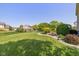 Expansive backyard with lush green lawn, landscaping, and a charming walkway; perfect for outdoor activities at 7140 Lakeland Trails Blvd, Indianapolis, IN 46259