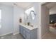 Bathroom featuring a double sink vanity, providing ample space at 7140 Lakeland Trails Blvd, Indianapolis, IN 46259