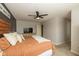 Spacious bedroom featuring a ceiling fan and a TV, offering comfort and entertainment at 7140 Lakeland Trails Blvd, Indianapolis, IN 46259