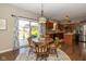 Eat-in kitchen features stainless steel appliances, wood cabinets, and sliding glass doors at 7140 Lakeland Trails Blvd, Indianapolis, IN 46259