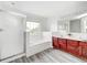 A bathroom featuring a shower, a jacuzzi tub, a window, and a vanity with double sinks at 725 Bristle Lake Dr, Brownsburg, IN 46112
