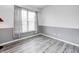 Cozy bedroom with natural light with neutral paint and complementary gray trim at 725 Bristle Lake Dr, Brownsburg, IN 46112