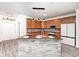 A kitchen island with stone accents, granite countertops, and pendant lighting at 725 Bristle Lake Dr, Brownsburg, IN 46112