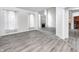 Open living area boasts abundant natural light, fireplace, and views of the kitchen at 725 Bristle Lake Dr, Brownsburg, IN 46112