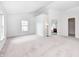 A main bedroom with three large windows, carpet, and an ensuite bathroom at 725 Bristle Lake Dr, Brownsburg, IN 46112