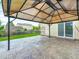 Covered patio with a stamped concrete floor, perfect for outdoor entertaining at 725 Bristle Lake Dr, Brownsburg, IN 46112