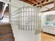 Modern bathroom with glass block partition wall and white cabinetry at 735 Lexington Ave # 23, Indianapolis, IN 46203