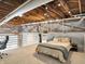 Bedroom with exposed beams, open ceilings, and a mezzanine at 735 Lexington Ave # 23, Indianapolis, IN 46203