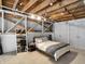 Bedroom with exposed beams and an attached office area at 735 Lexington Ave # 23, Indianapolis, IN 46203