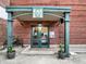 Welcoming building entrance with covered walkway, secure entry, and decorative potted plants at 735 Lexington Ave # 23, Indianapolis, IN 46203
