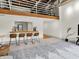 Open concept living area with wooden bar seating and a loft area, creating a stylish and functional space at 735 Lexington Ave # 23, Indianapolis, IN 46203
