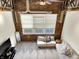 Bright living room with exposed brick and large windows at 735 Lexington Ave # 23, Indianapolis, IN 46203