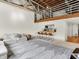 Bright living space with modern furnishings, wooden bar seating, and a loft area, offering a versatile layout at 735 Lexington Ave # 23, Indianapolis, IN 46203