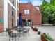 Charming outdoor patio with comfortable seating, perfect for entertaining or relaxing in a garden setting at 735 Lexington Ave # 23, Indianapolis, IN 46203