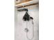 Contemporary shower featuring a rainfall showerhead with white marbled tile and exposed wooden beams at 735 Lexington Ave # 23, Indianapolis, IN 46203
