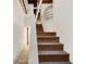 Stairway with wood stairs and a modern glass block accent at 735 Lexington Ave # 23, Indianapolis, IN 46203