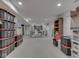 Finished basement area with storage containers, open space, and potential for various uses at 748 Woodcreek Ct, Greenwood, IN 46142
