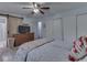 Comfortable bedroom featuring a large closet, wood dresser, and a sliding barn door leading to the en-suite bathroom at 748 Woodcreek Ct, Greenwood, IN 46142