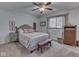 Charming bedroom with neutral walls, plush carpet, and a comfortable upholstered bed with decorative pillows at 748 Woodcreek Ct, Greenwood, IN 46142