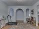 Light-filled bonus room featuring hardwood floors, three alcoves, and an accent rug at 748 Woodcreek Ct, Greenwood, IN 46142