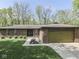 Beautiful brick home with an attached garage and a well-maintained lawn in a desirable neighborhood at 748 Woodcreek Ct, Greenwood, IN 46142