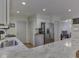 Bright kitchen with granite counters, stainless steel appliances, white cabinets and ample counter space at 748 Woodcreek Ct, Greenwood, IN 46142