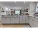 Open kitchen with granite counters, stainless steel appliances, and white cabinets at 748 Woodcreek Ct, Greenwood, IN 46142
