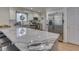 Kitchen with granite counters, stainless steel appliances, white cabinets, and wood floors at 748 Woodcreek Ct, Greenwood, IN 46142