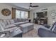 Comfortable living room with a plush sectional, large window, and neutral decor creating a relaxing space at 748 Woodcreek Ct, Greenwood, IN 46142