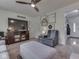 Inviting living room with comfortable seating, modern entertainment center, and decorative wall accents at 748 Woodcreek Ct, Greenwood, IN 46142