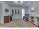 Well-lit home office with a wooden desk, comfortable chair, and stylish decor for a productive workspace at 748 Woodcreek Ct, Greenwood, IN 46142