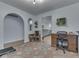 Versatile space showcasing an office area that transitions into an additional space with unique architectural details at 748 Woodcreek Ct, Greenwood, IN 46142