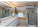 Spacious bathroom with double sinks, built in tub with jets, and a separate shower, ideal for relaxation at 7608 Harbour, Indianapolis, IN 46240