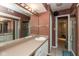 Bathroom with a double vanity, tiled floor, a large mirror, and a separate shower, great for daily use at 7608 Harbour, Indianapolis, IN 46240